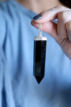 Penjoll de plata amb cristall d'Obsidiana.