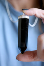 Penjoll de plata amb cristall d'Obsidiana.