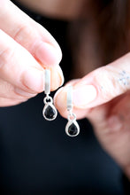 Arracades de plata i Espinel·la negra.