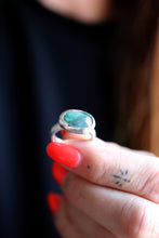 Anell de plata amb Maragda facetada.