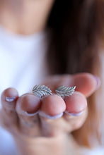 Arracades fulles de plata.