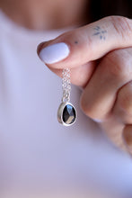 Penjoll de plata amb Ònix facetat natural.