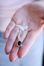Penjoll de plata amb Ònix facetat natural.