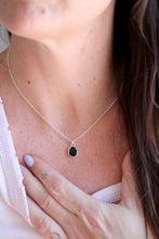 Penjoll de plata amb Ònix facetat natural.